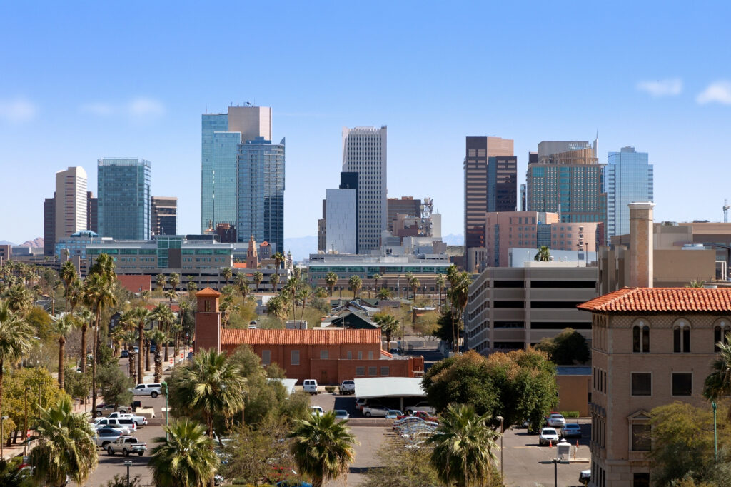 Skyline of downtown Phoenix, Arizona, featuring high-rise glass buildings and the prominent Chase Tower.