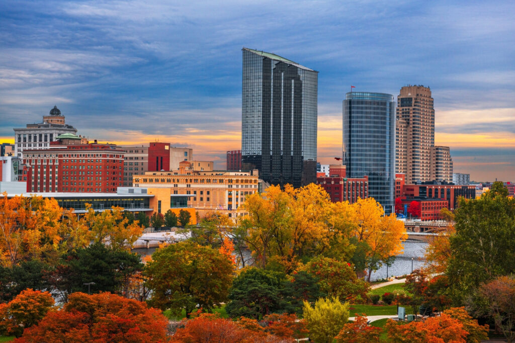 Michigan lakeside skyline with city buildings and fall trees