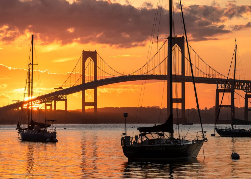 Aerial view of Newport Harbor with sailboats at sunset