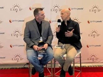 Richard Canfield being interviewed by entrepreneur and author and book Publisher Kary Oberbrunner at a business conference.